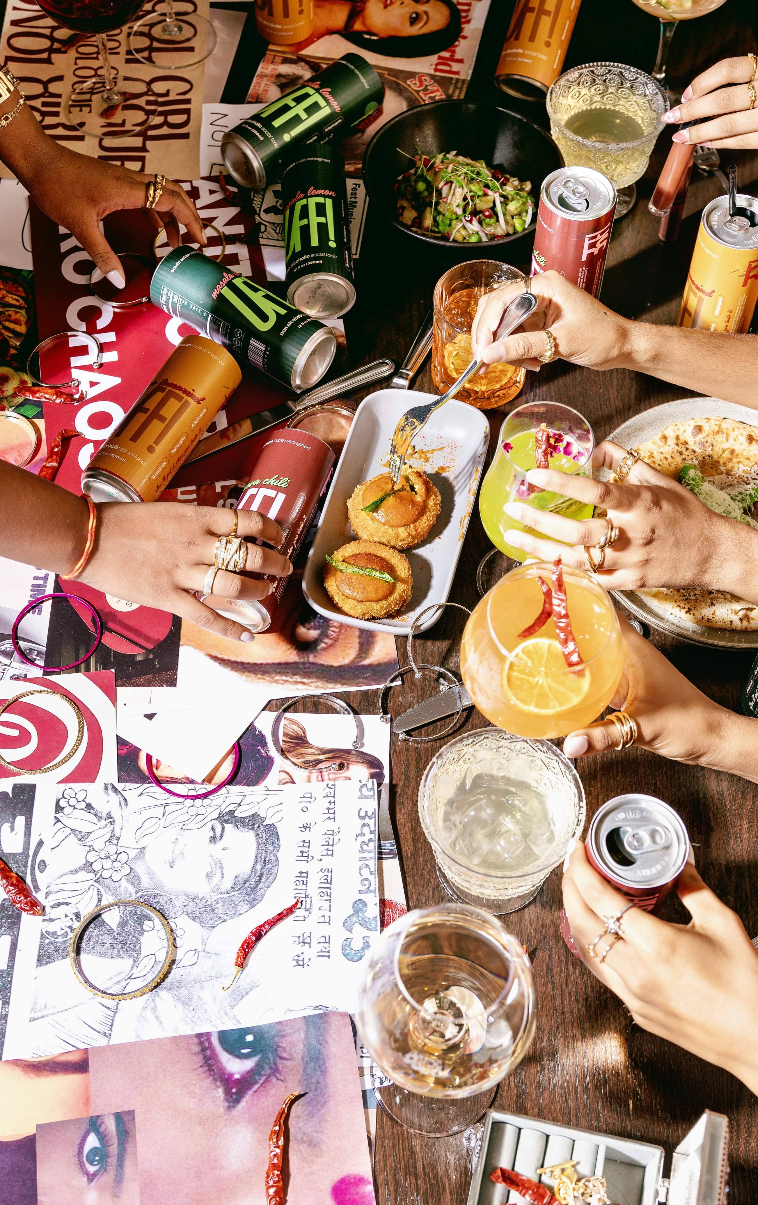 The table, mid-feast — a collage of cans, chaat and clippings