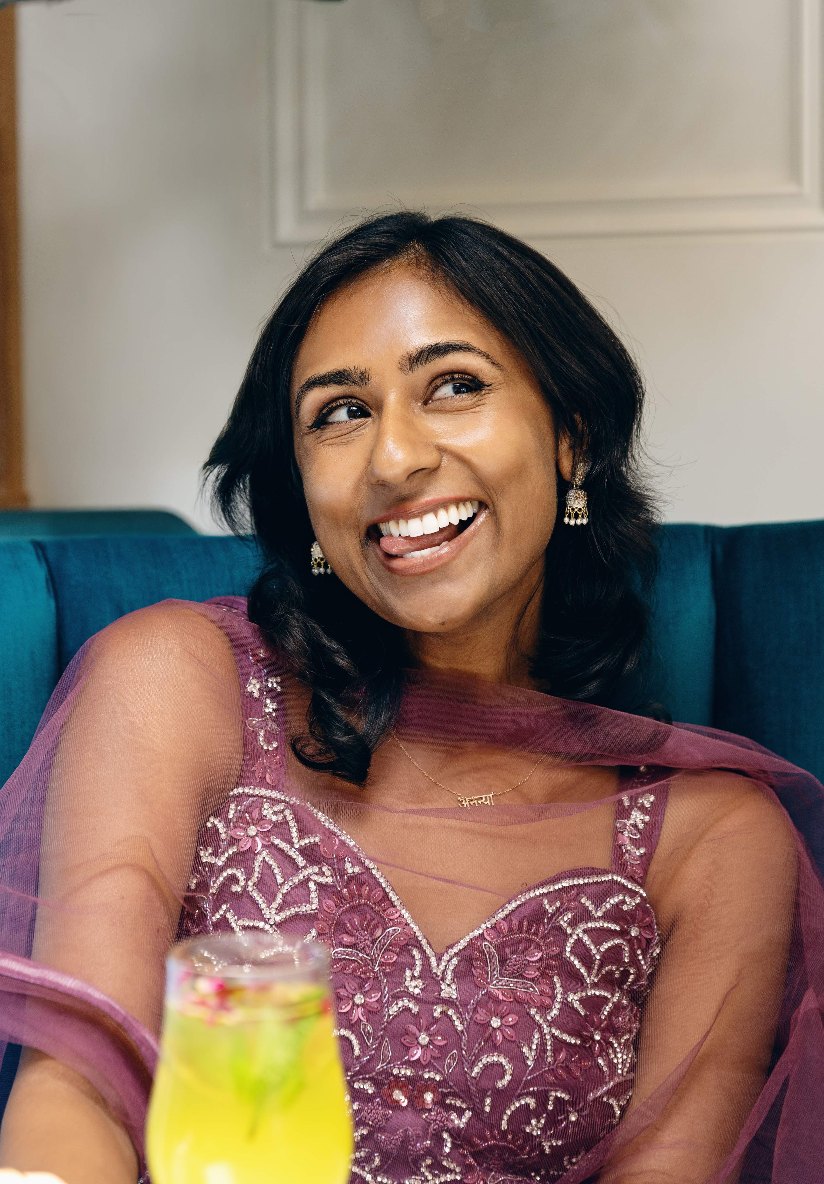 Smiling in a pink saree