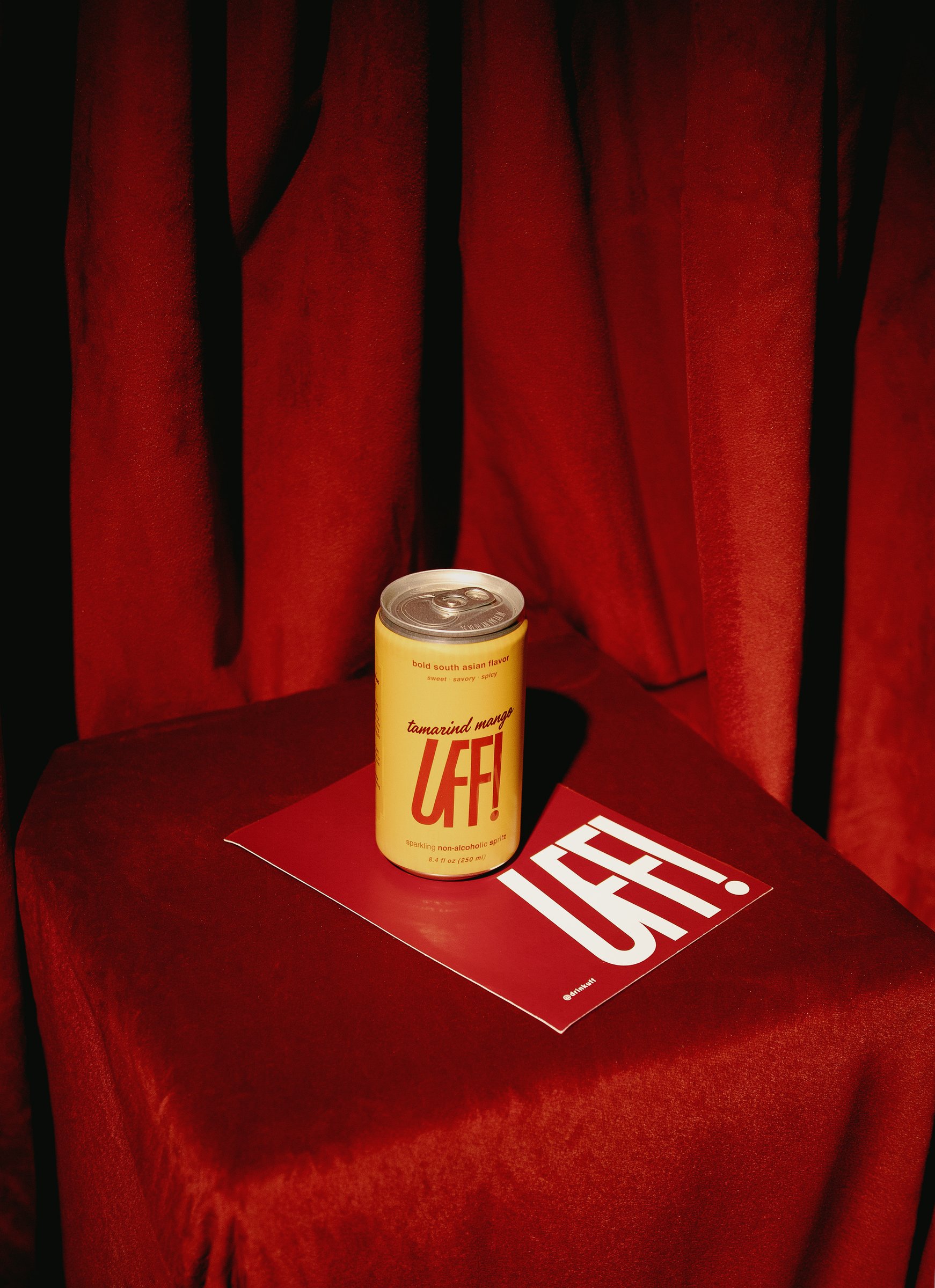 The UFF! Tamarind Mango can on red velvet