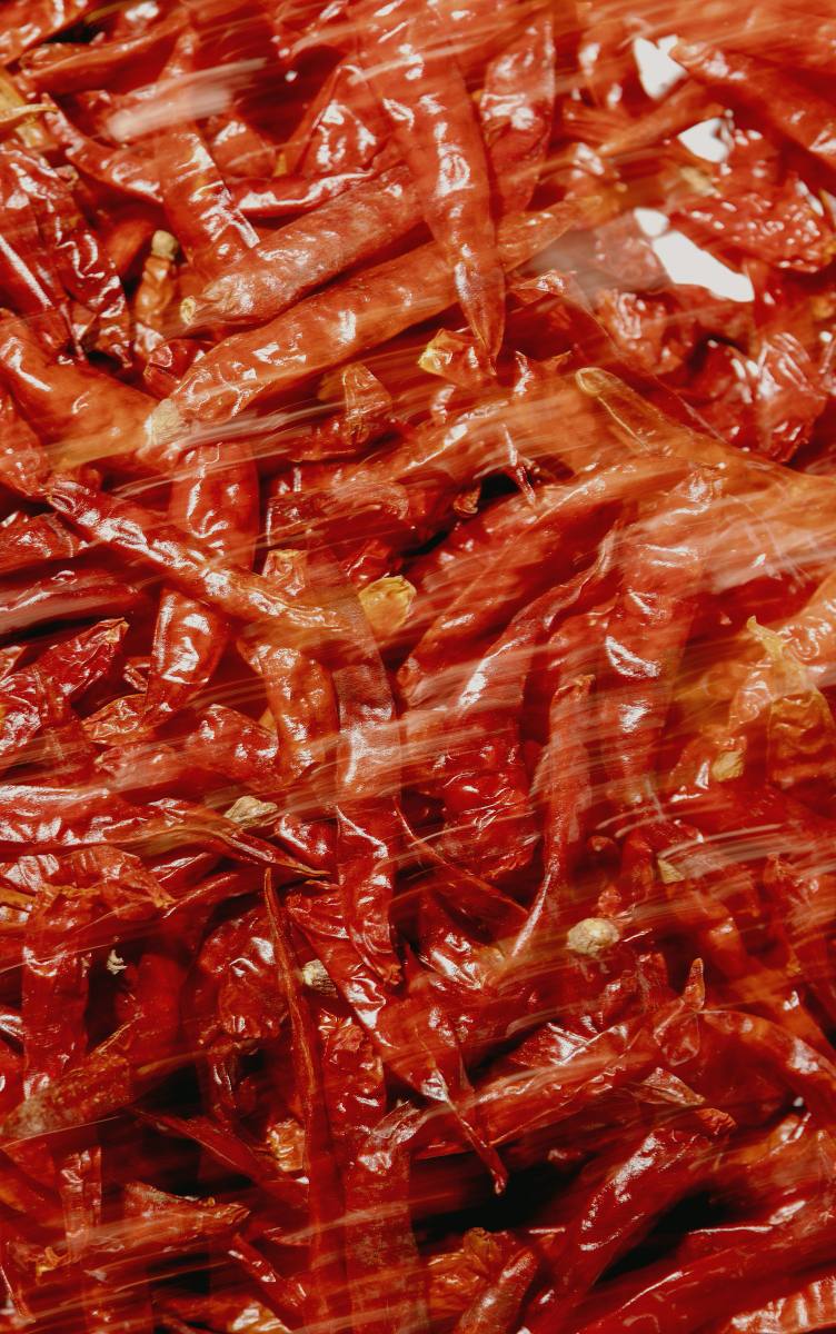Sun-dried red mirchi, mid-toss