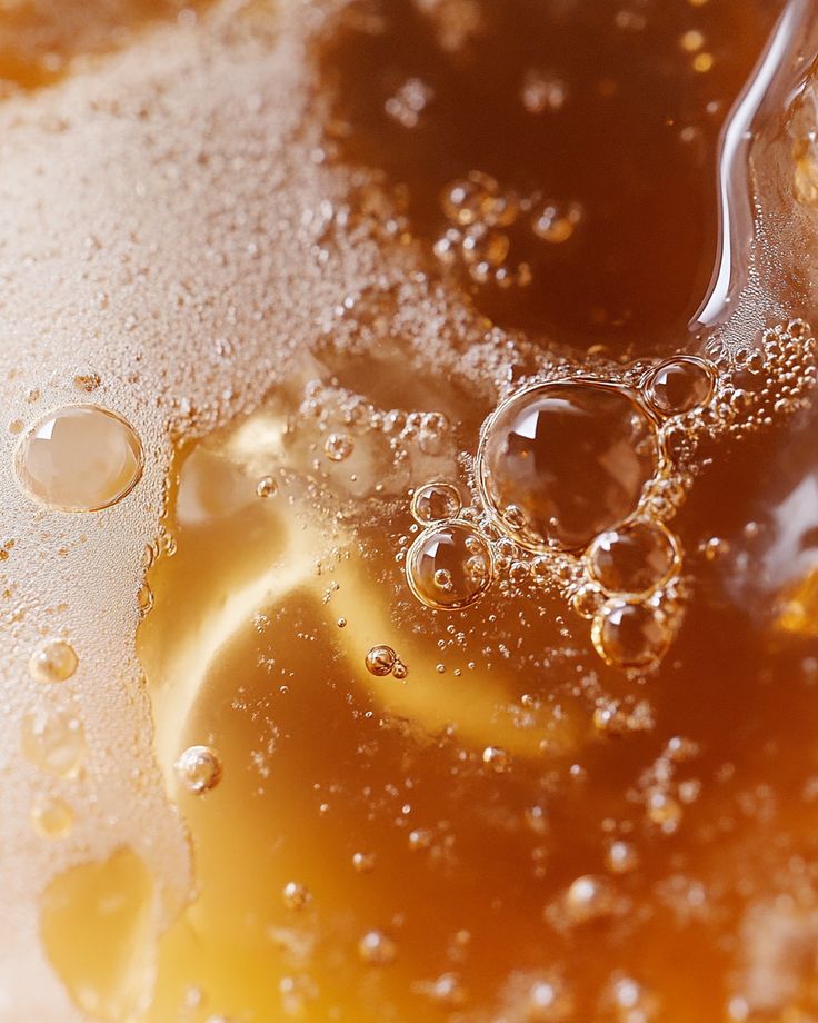 A close-up of the spritz, gold and full of bubbles