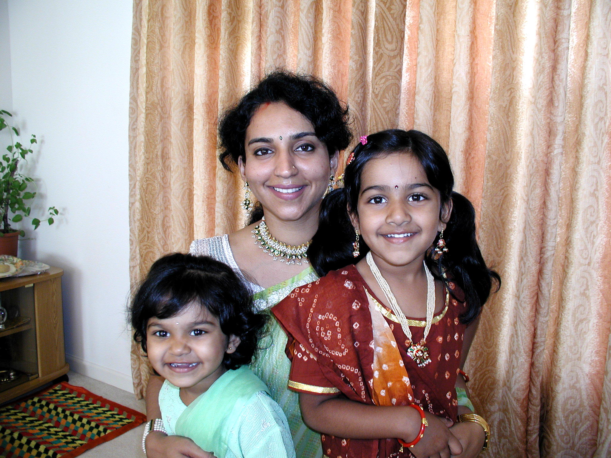 Dressed up with her mother and sister as children
